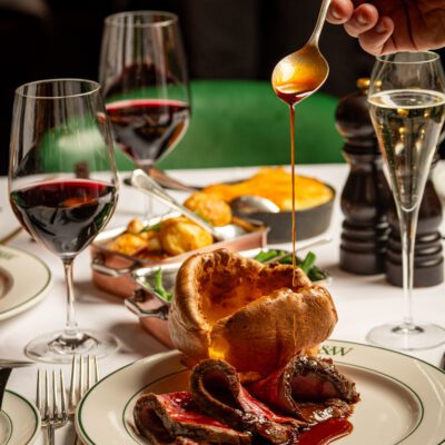 A digital asset with an illustration of a fillet and wine bottle